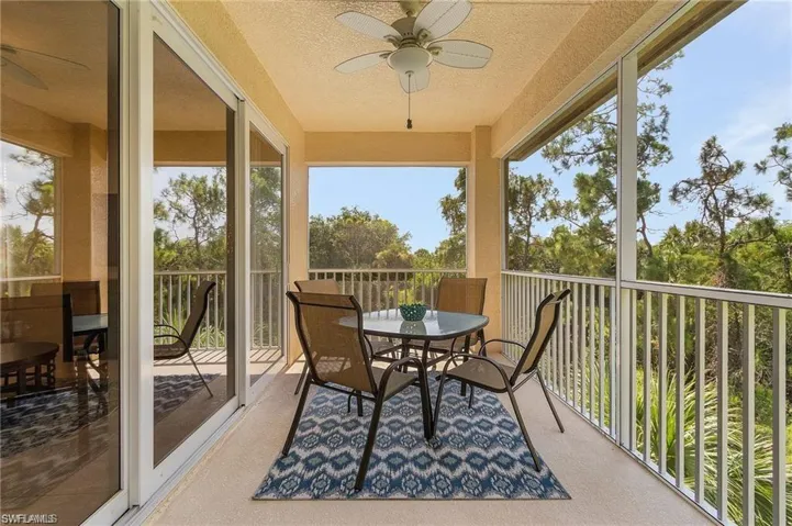 Sunroom featuring ceiling fan