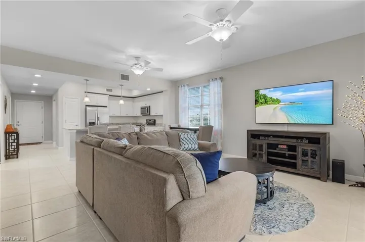 Tiled living room with ceiling fan
