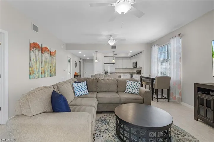 Tiled living room with ceiling fan
