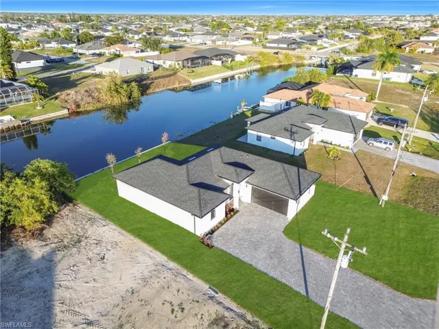 Aerial view of residential area with a large body of water