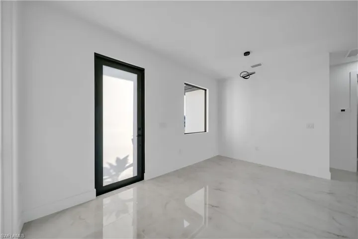 Empty room with light marble finish flooring