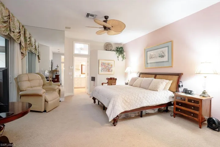 Large Primary Suite ceiling fan, and carpet floors