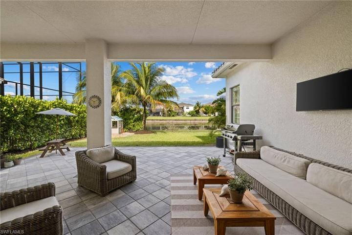 Extended Lanai and lots of yard space overlook the lake beyond