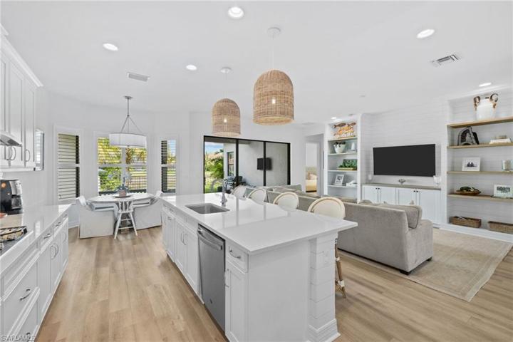 Gorgeous, pristine kitchen with quartz counters, gas cooking and stainless appliances.