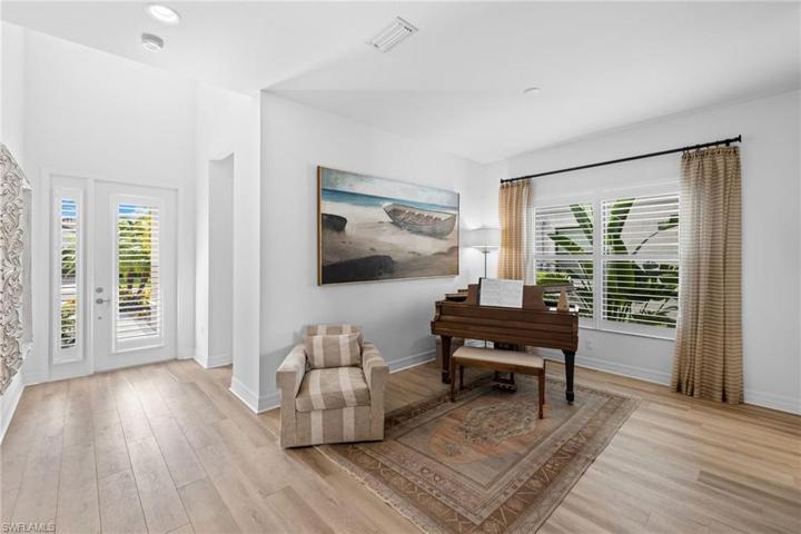 Open floor plan includes this dining room turned music room plus the primary bedroom and a 2nd bedroom/office/exercise or hobby room on the first floor.