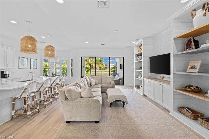 This is it!  So many high end upgrades!  Shiplap walls, wooden shelves, wide plank floors, chic lighting and so much more.