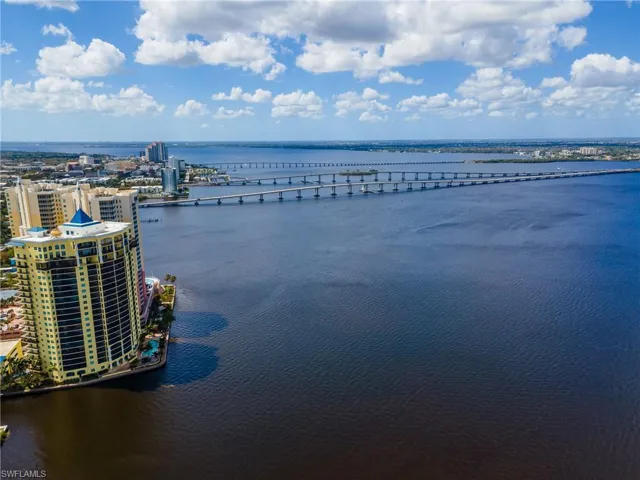 Water view with a notable bridge and nearby urban area