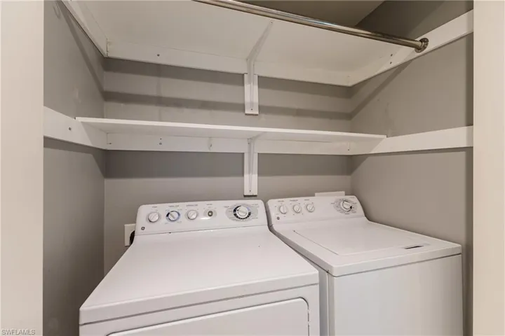 Laundry area with washer and clothes dryer