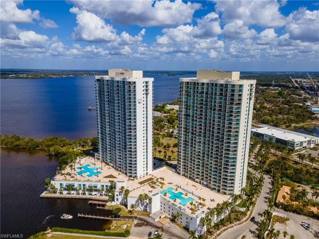 Bird's eye view of a nearby body of water and apartment complex