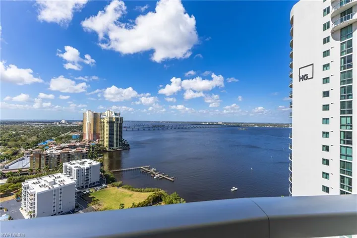 Water view featuring a notable bridge and nearby urban area