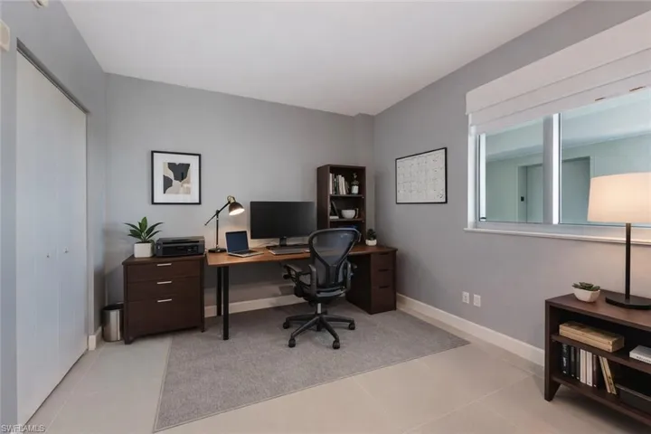 Bedroom virtually staged as an Office with light tile patterned flooring