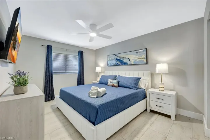 Bedroom featuring baseboards and ceiling fan