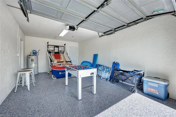 Garage with a textured wall and water heater