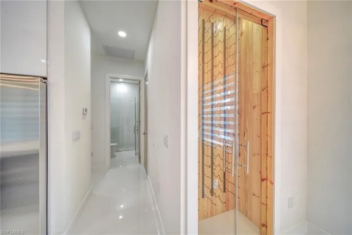 Hallway featuring baseboards