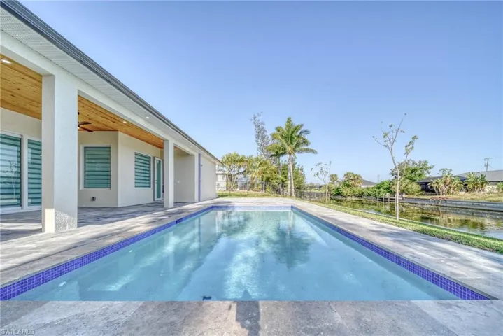 View of swimming pool with a patio area
