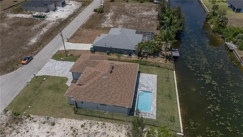View from above of property with a large body of water