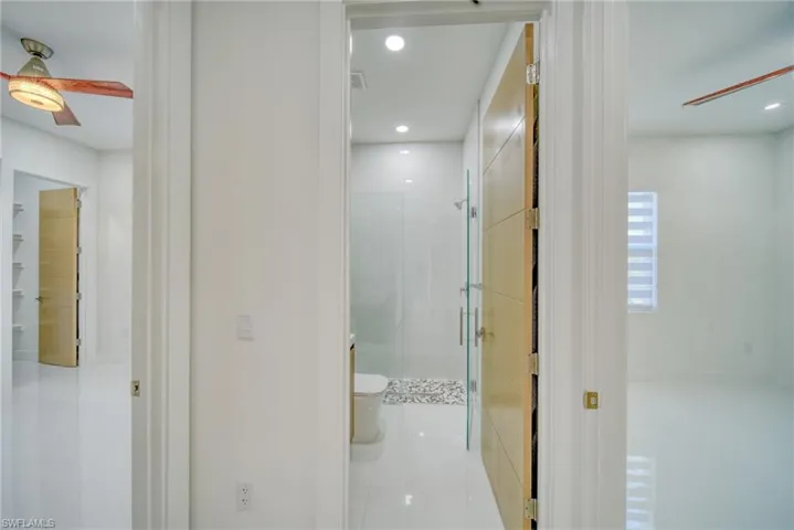 Corridor featuring tile patterned floors and recessed lighting