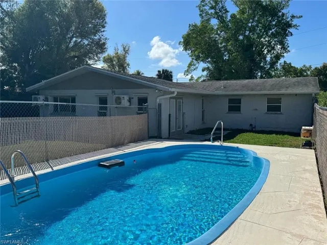 View of pool with a fenced backyard