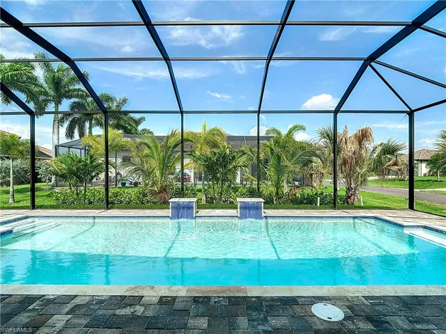 View of pool with a lanai