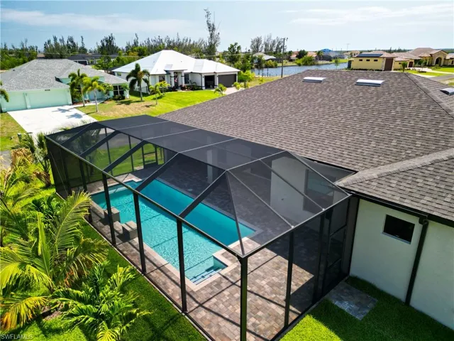 View of pool featuring a lanai and a yard