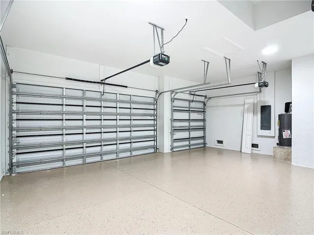 Garage with a garage door opener and water heater