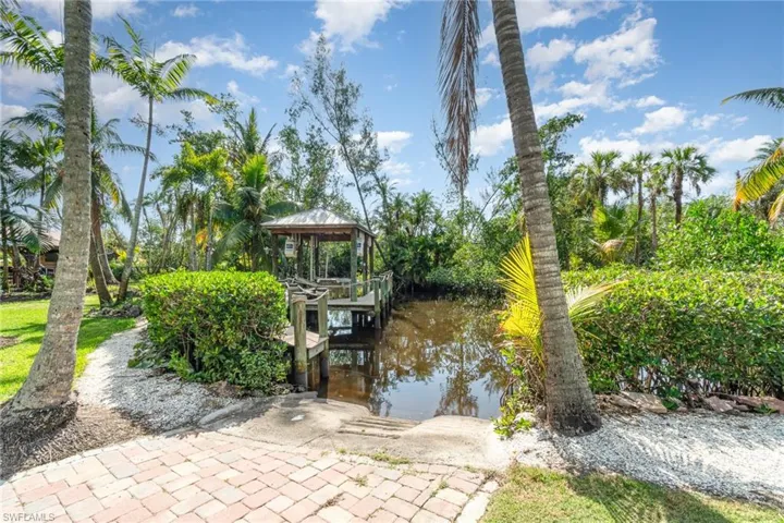 View of dock with a water view and a gazebo