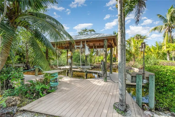 Deck with boat lift and a boat dock