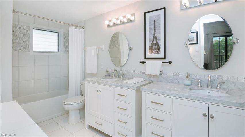 other side of primary bathroom with tub