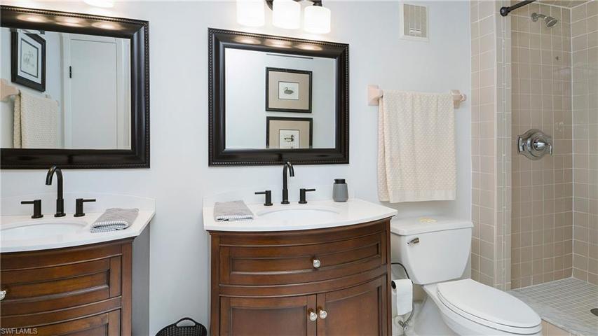 dual sinks and a walk in shower