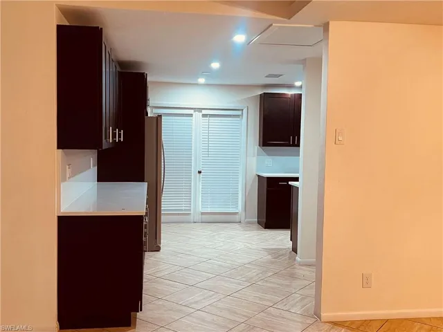 Kitchen with stainless steel fridge