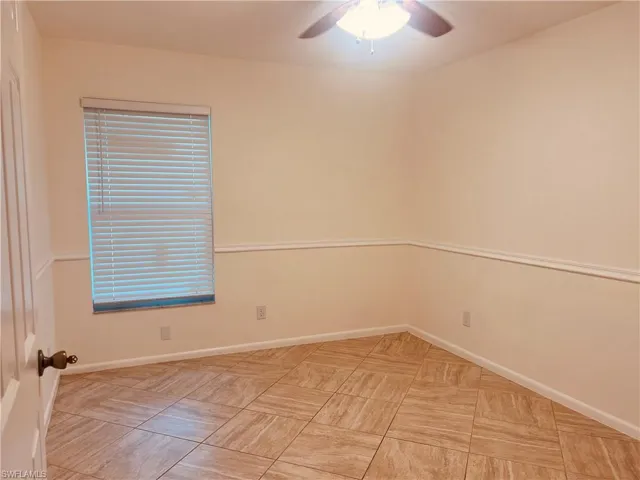 Spare room featuring ceiling fan