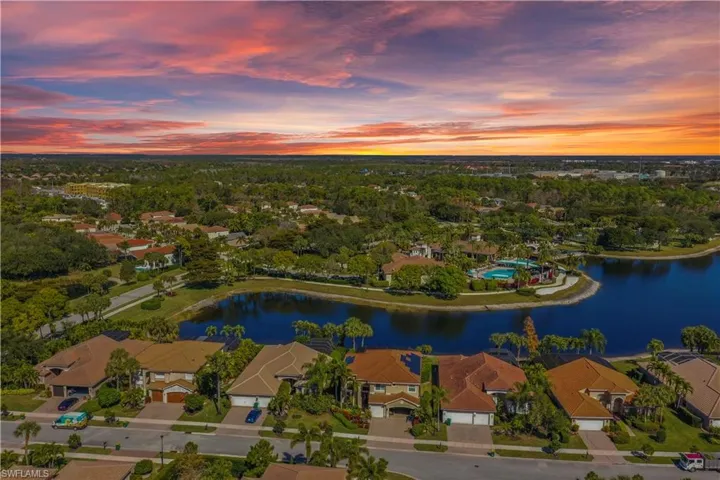 Aerial perspective of suburban area with a nearby body of water