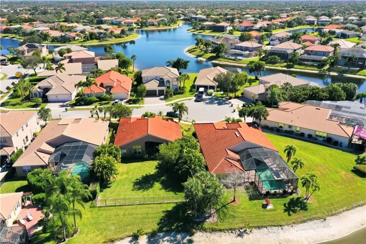 Aerial overview of property's location featuring a nearby body of water and nearby suburban area