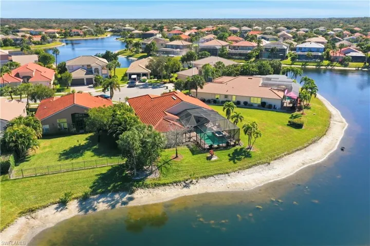 Aerial perspective of suburban area with a large body of water