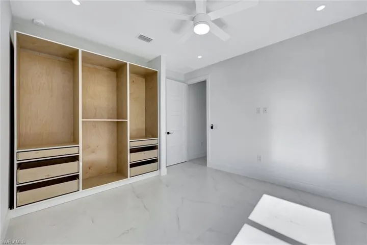 Doors to closet match kitchen cabinet doors.
