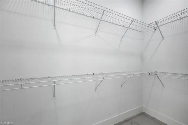 Primary closet offers plenty of space for two.