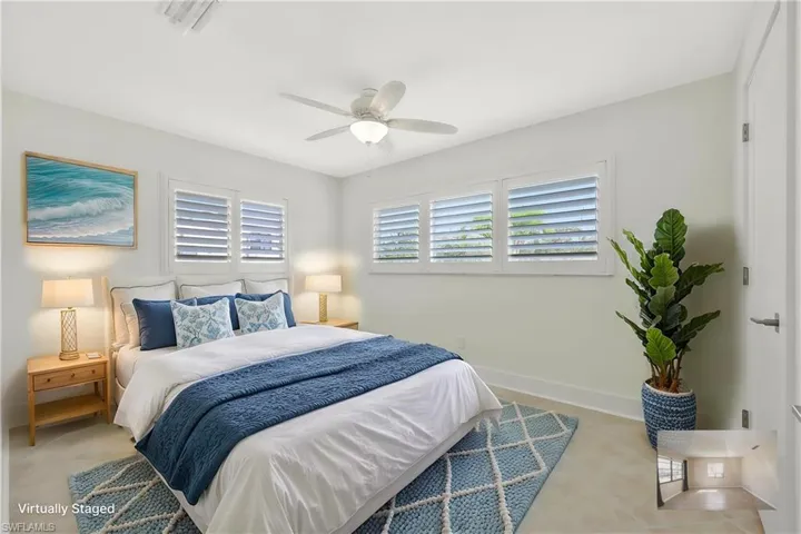Bedroom with baseboards and ceiling fan