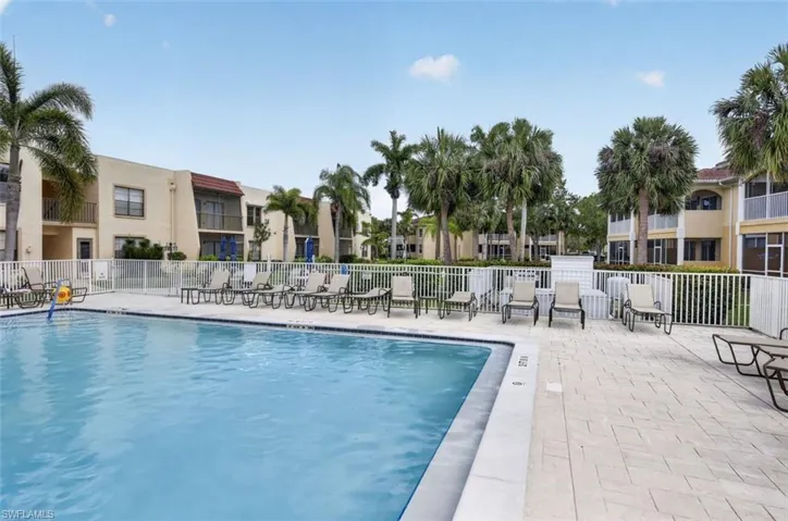 Community pool featuring a patio
