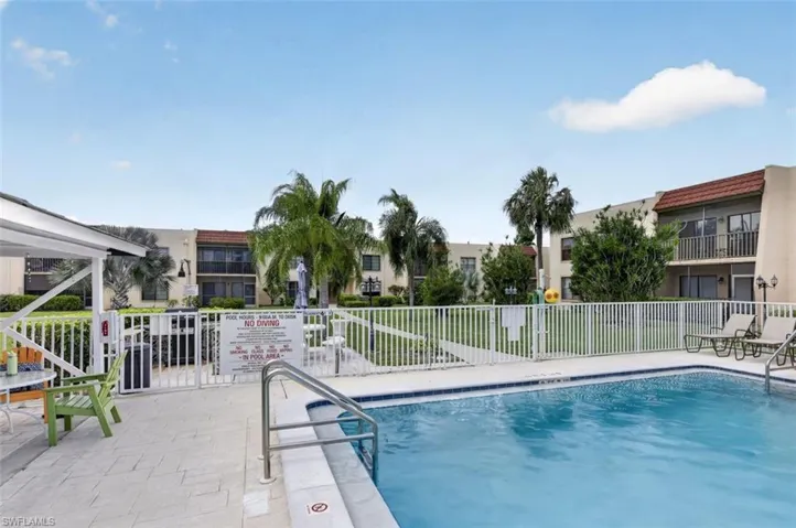 Community pool featuring a patio area