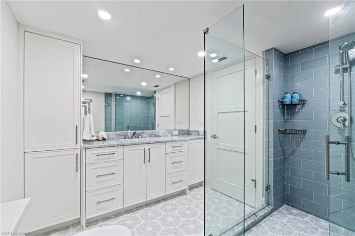Guest Bathroom has a large walk in shower and custom tile selections