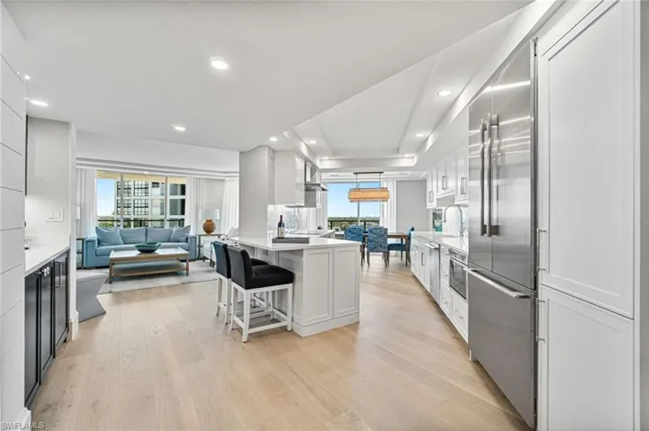 View of the main living area- kitchen, wet bar, living room and dining room