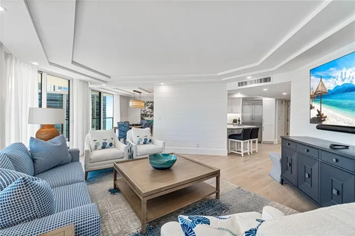 Living area facing dining room and kitchen