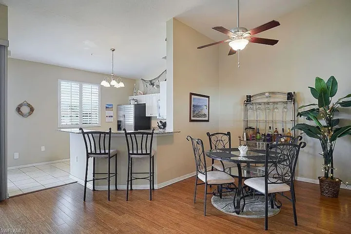 Dining space with high vaulted ceiling