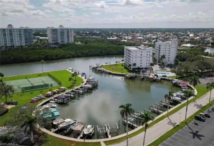 View of urban area with a marina and a large body of water