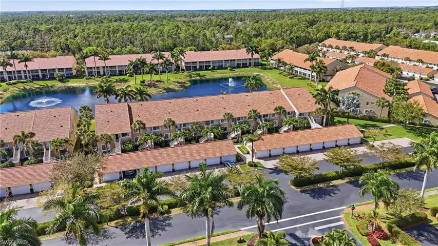 Aerial view of apartment complex / building and a nearby body of water
