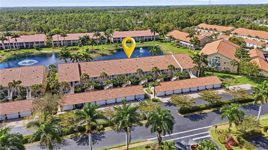 Aerial view of apartment complex and a large body of water