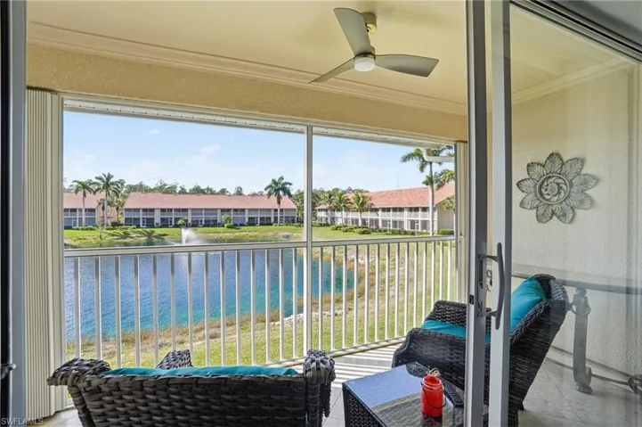 Sunroom featuring a water view