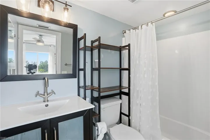 Full bathroom with vanity and shower / tub combo