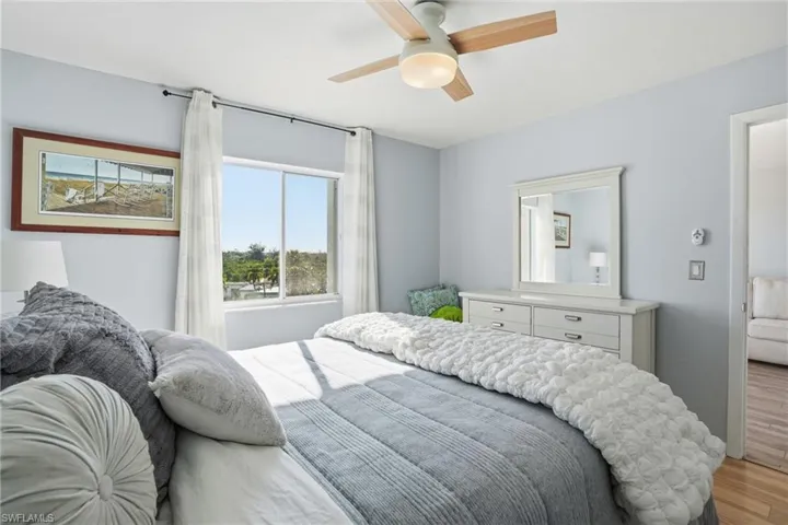 Bedroom featuring ceiling fan and wood finished floors
