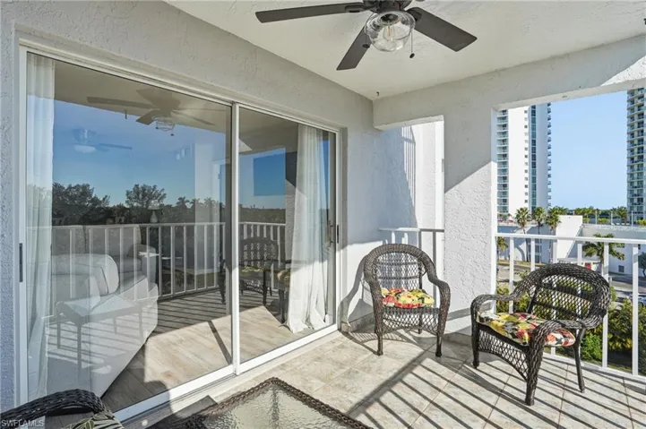 Balcony featuring ceiling fan